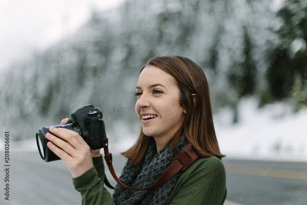 Woman Smiling and Taking Photographs with DSLR Woman Smiling and Taking Photographs with DSLR