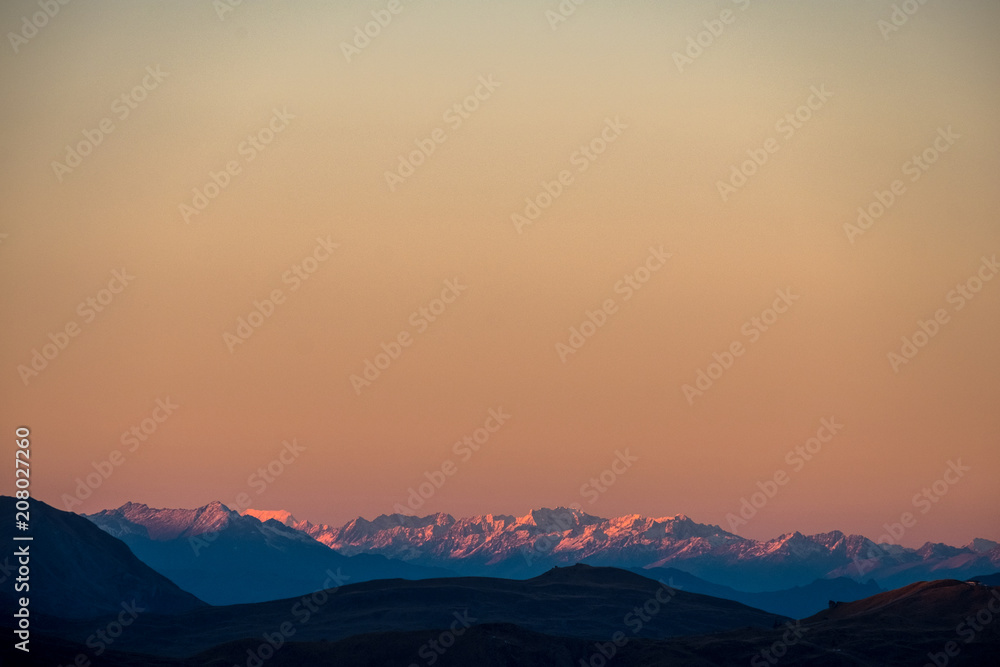 A stunning scene of sunset on the top of Alps mountain.