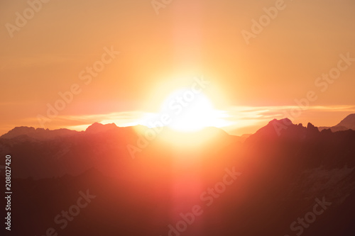 A stunning scene of sunset on the top of Alps mountain.