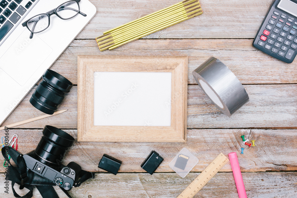 Photo blogger desk with camera, batteries office desk flat lay Photo blogger desk with camera, batteries office desk flat lay