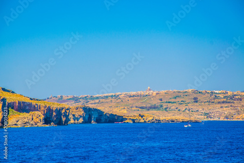 Seaside view of Qala on Gozo island, Malta photo