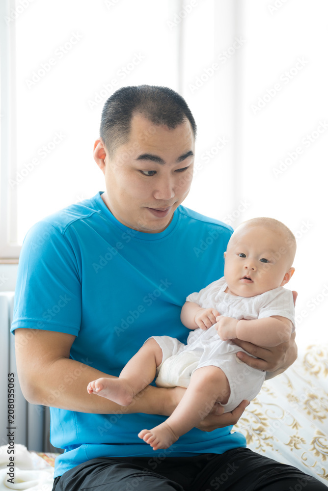 A young blind man with his newborn baby A young blind man with his newborn baby