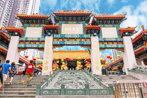 HONG KONG, CHINA - MAY 5, 2018: Unidentified people enter Sik Sik Yuen Wong Tai Sin temple at Kowloon in Hong Kong, China..