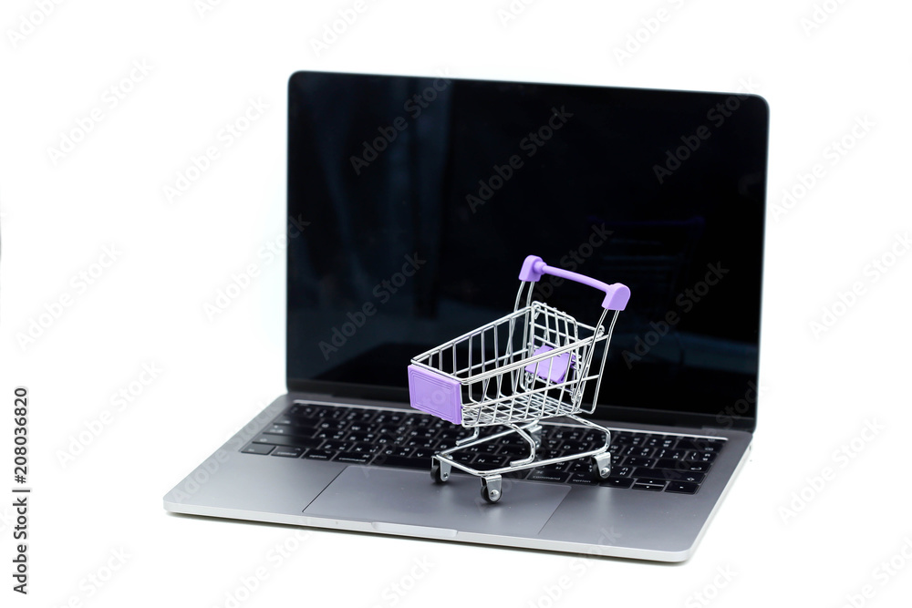 Shopping cart on a laptop,concept about online purchase and shopping.