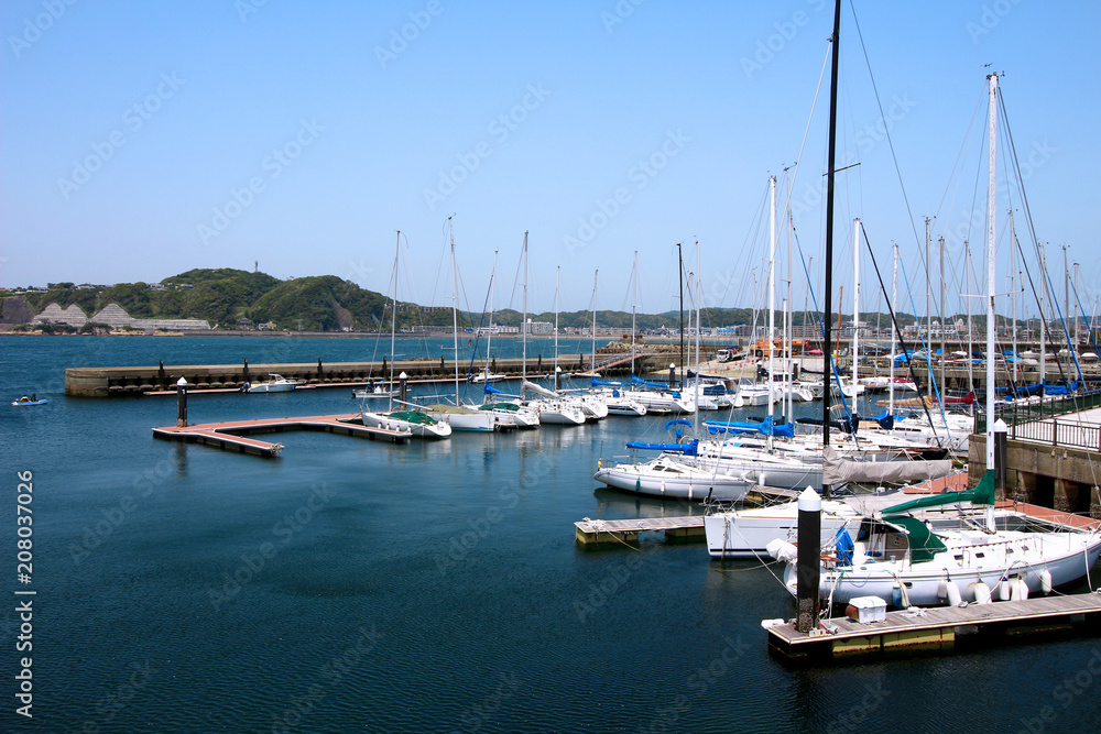Scenery of yacht harbor facing calm sea of summer