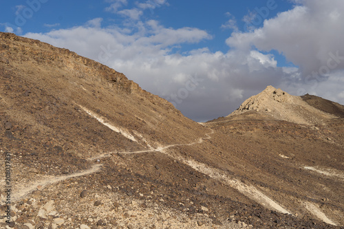 Trekking in Negev dramatic stone desert, Israel