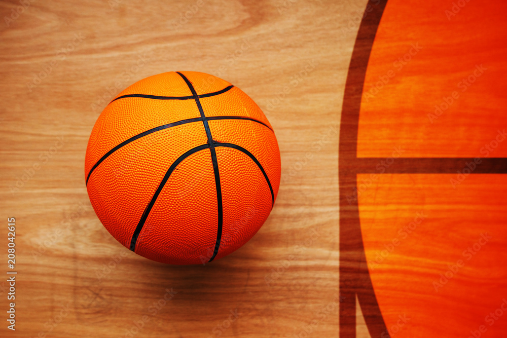 Naklejka premium Basketball ball on court floor