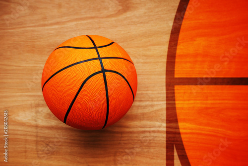 Basketball ball on court floor