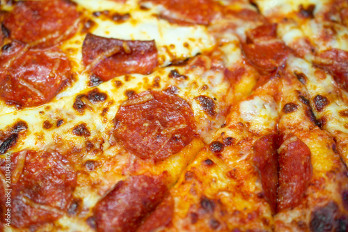 Macro shot of pepperoni pizza.