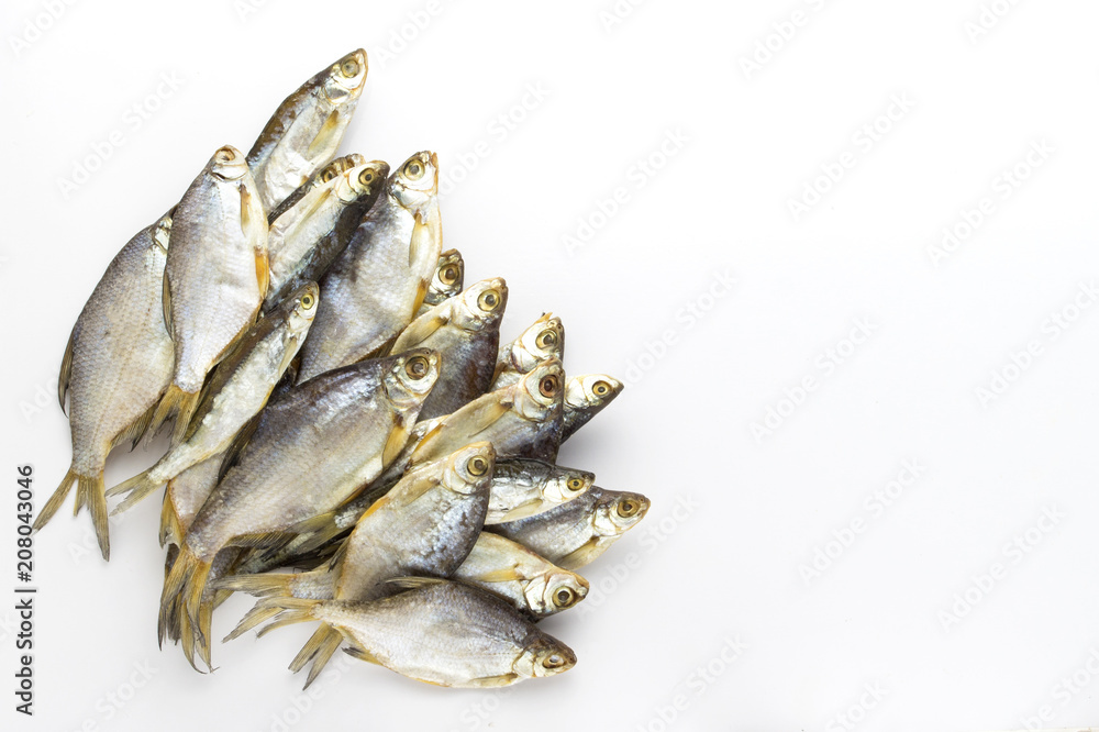 Dried fish on a white background. Flat lay, top view Dried fish on a white background. Flat lay, top view