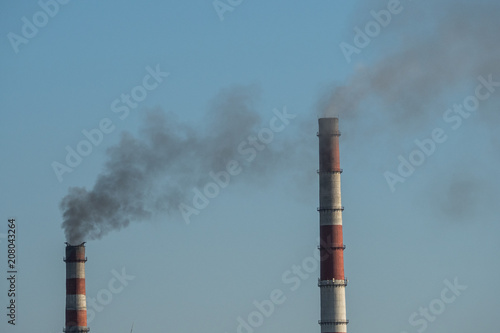 The plant emits smoke from the pipes, pollutants enter the atmosphere