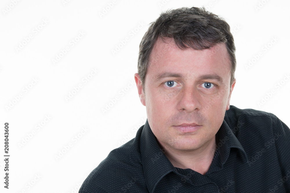 Closeup portrait of middle aged businessman in white office with copy space Closeup portrait of middle aged businessman in white office with copy space