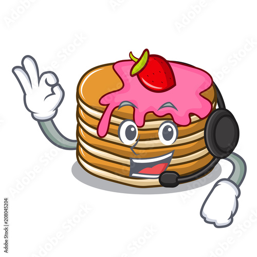 With headphone pancake with strawberry mascot cartoon
