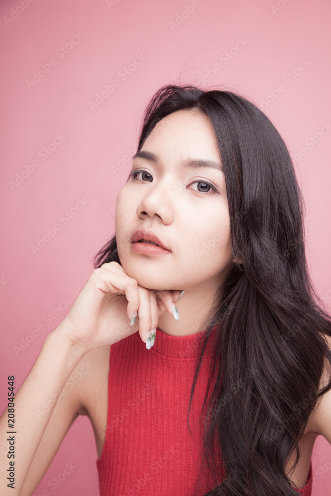 Portrait of beautiful young Asian woman in red shirt Portrait of beautiful young Asian woman in red shirt