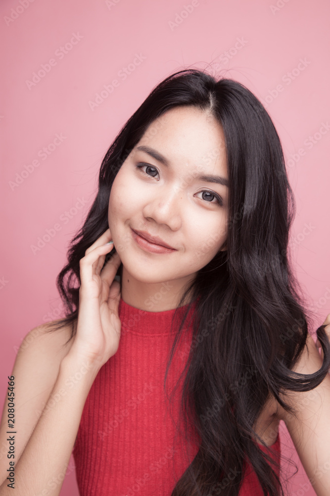 Portrait of beautiful young Asian woman in red shirt Portrait of beautiful young Asian woman in red shirt