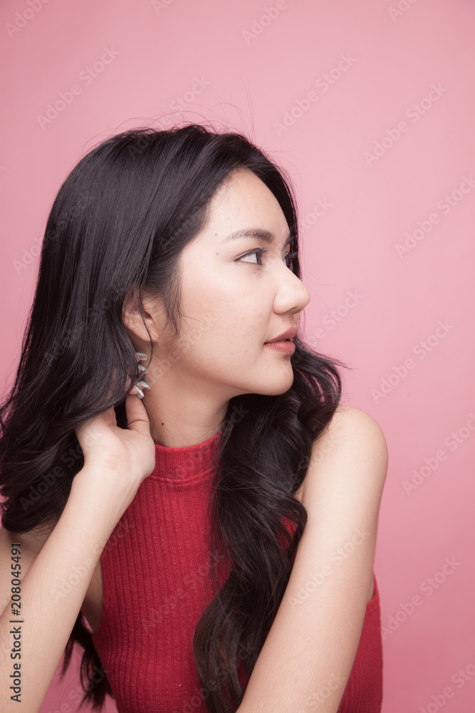 Portrait of beautiful young Asian woman in red shirt Portrait of beautiful young Asian woman in red shirt