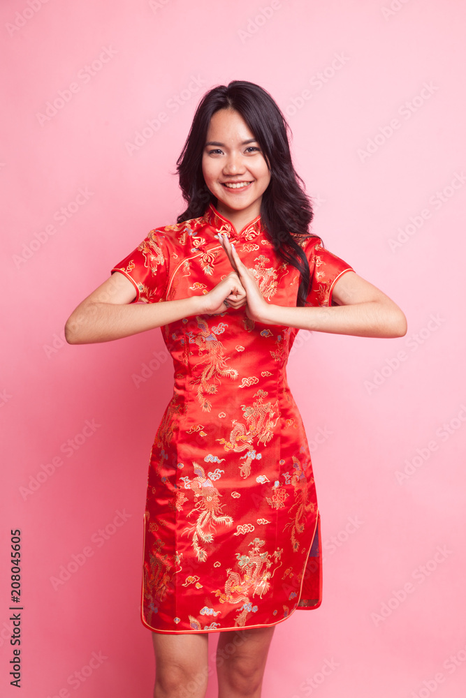 Cute Asian girl in chinese red cheongsam dress Cute Asian girl in chinese red cheongsam dress