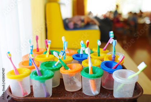 Obraz na płótnie Colorful children's toothbrushes. Group of baby toothbrush prepare for use with children. w salonie