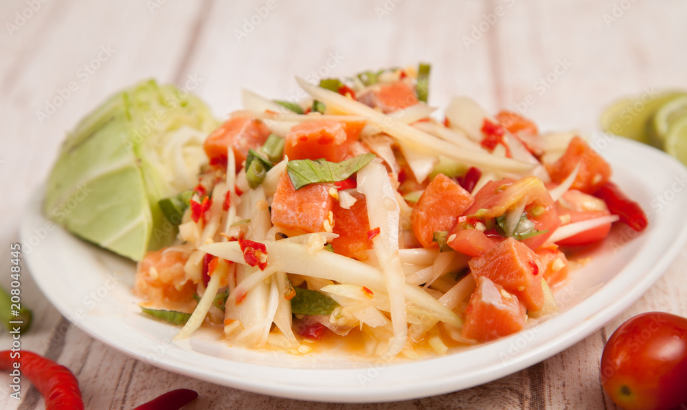 spicy papaya salad with fresh salmon - som tam thai food spicy papaya salad with fresh salmon - som tam thai food
