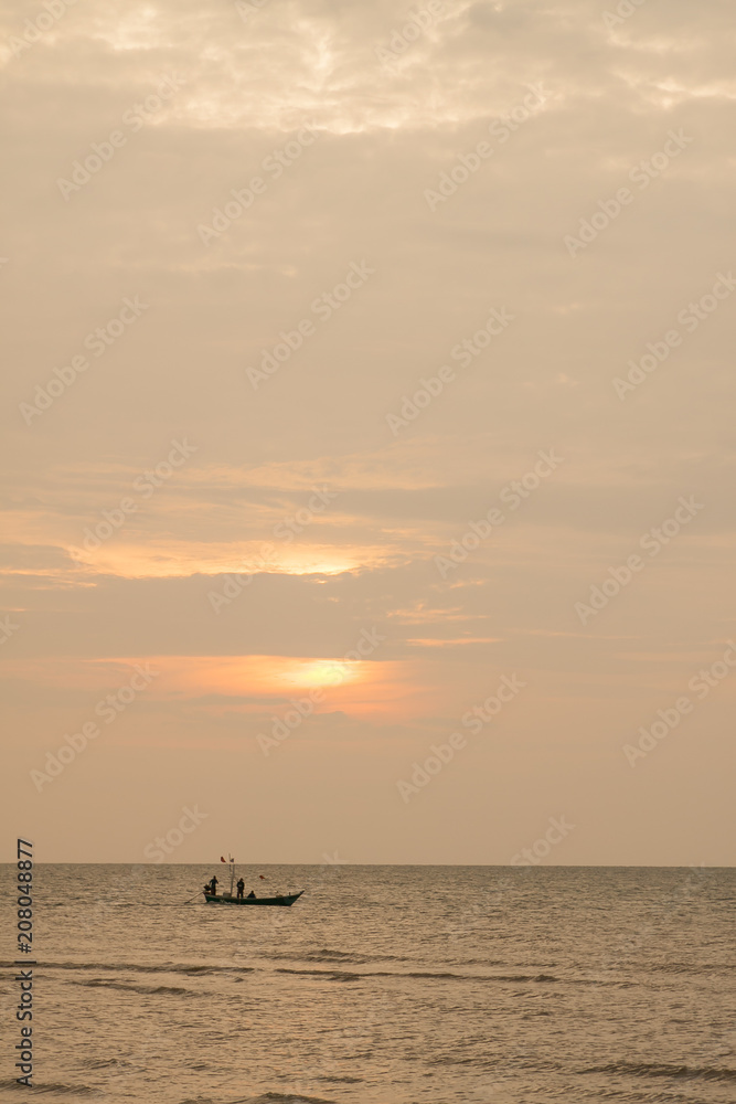 The boat in the sea during the sunset The boat in the sea during the sunset