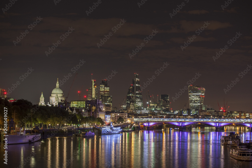 london skyline and river thames at night