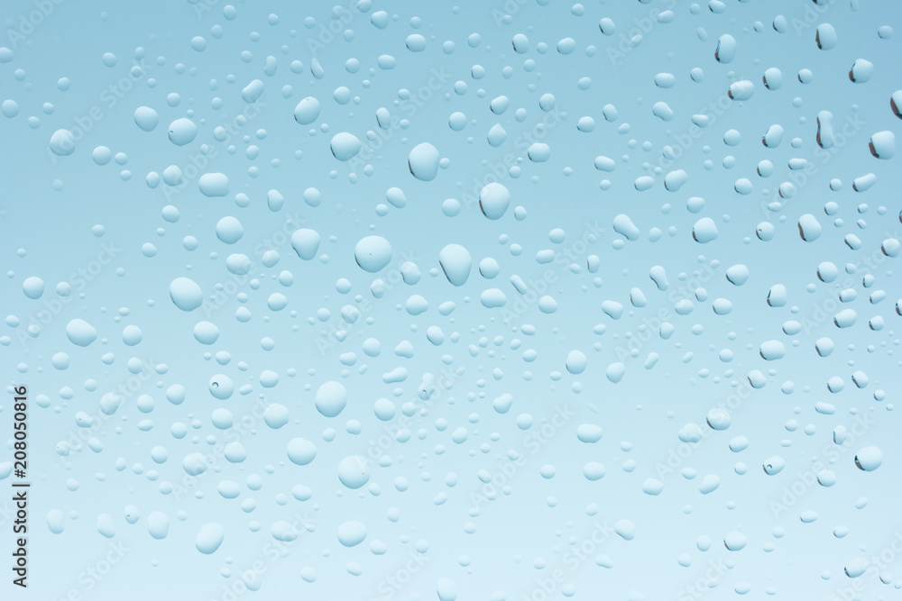 Macro photo of water drops on blue background