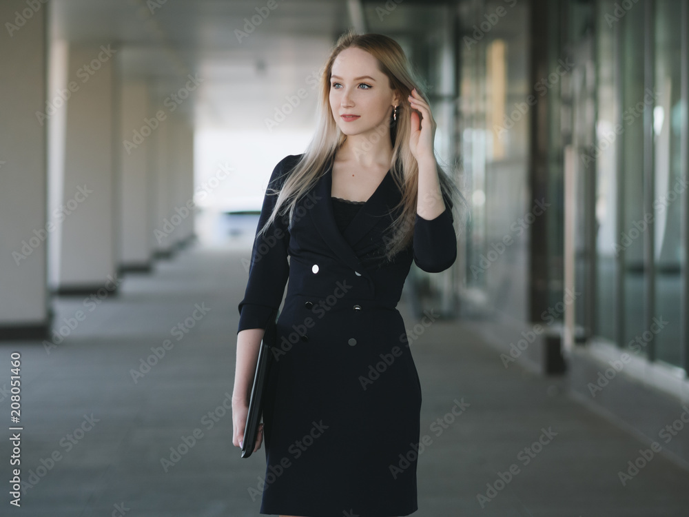 Young businesswoman with laptop. Selective focus. Young businesswoman with laptop. Selective focus.