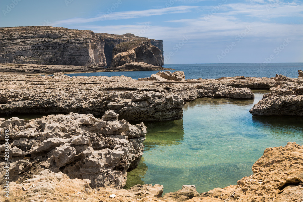 Fototapeta premium Sea shore with a mountain, Gozo, Malta