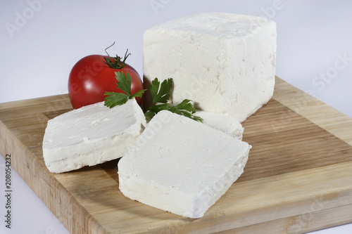 cheese on wooden board isolated on white