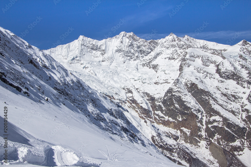 Ski Tracks in a Swiss mountains in Saas-Fee Ski Tracks in a Swiss mountains in Saas-Fee