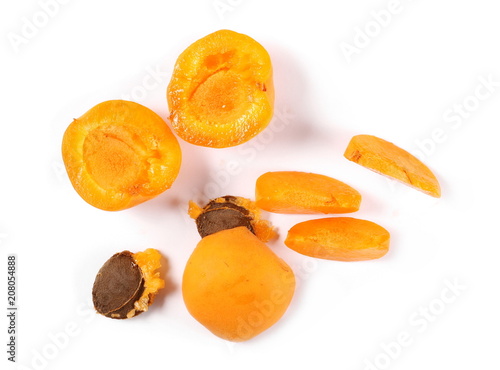 Fresh cut apricot fruit slices isolated on white background, top view