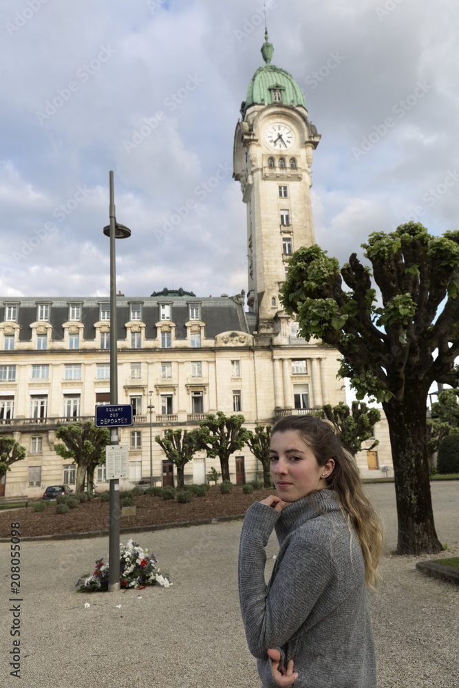 Teenager looking at camera in front of the Limoges station