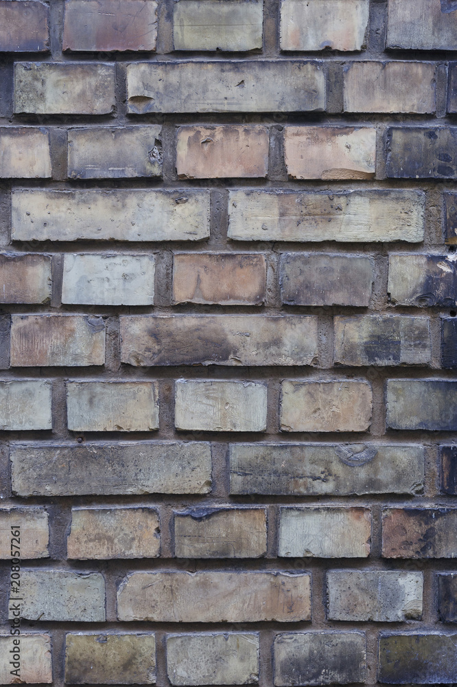 old brick wall of bricks of different colours closeup. old brick wall of bricks of different colours closeup.