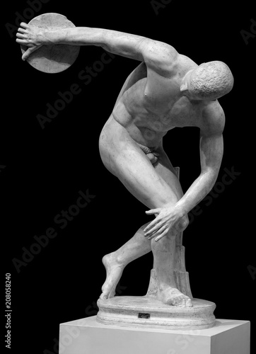 Discus thrower ancient greek marble statue isolated on black photo