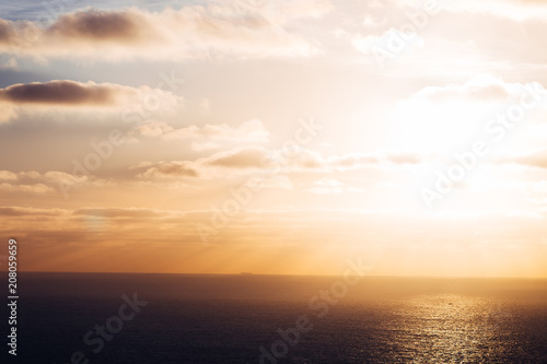 beautiful sunset on a quiet and calm sea among which the ship can be seen © Ivan