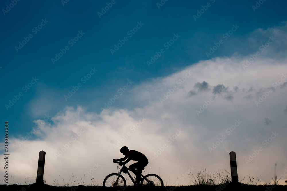 Obraz premium Ride on bike on the road. Sport and active life concept in the summer time