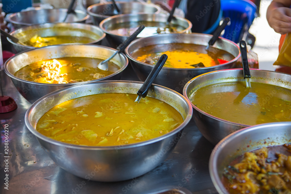 Asian street Food. People cooking, selling and buying Exotic Asian Food Asian street Food. People cooking, selling and buying Exotic Asian Food
