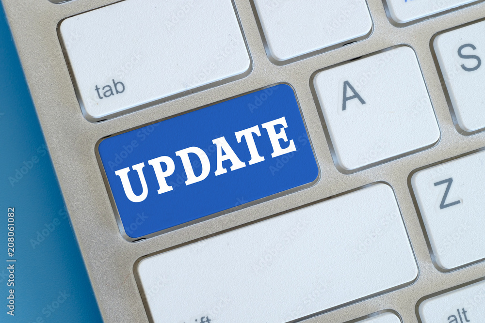 Closed up computer keyboard with words UPDATE