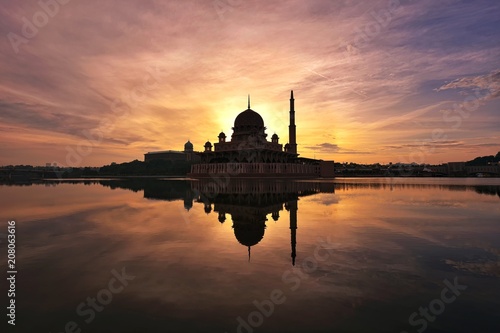 Reflections of silhouette mosque during sunrise © fiz_zero