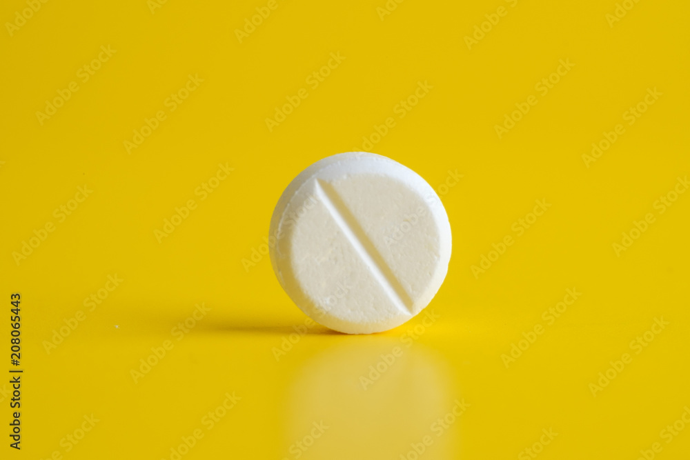White pill on yellow background White pill on yellow background