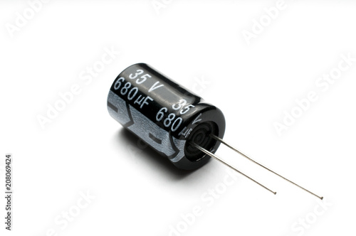 Electrolytic capacitor isolated on white background photo