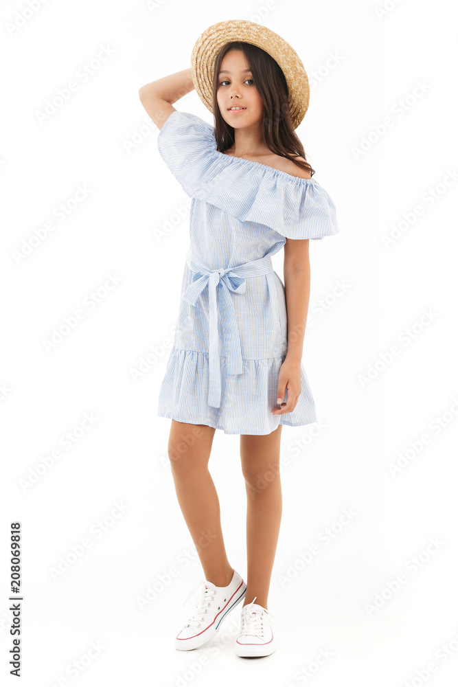 Full length image of Smiling young brunette girl in dress Full length image of Smiling young brunette girl in dress