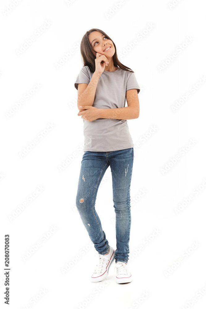 Thinking girl standing isolated looking aside. Thinking girl standing isolated looking aside.