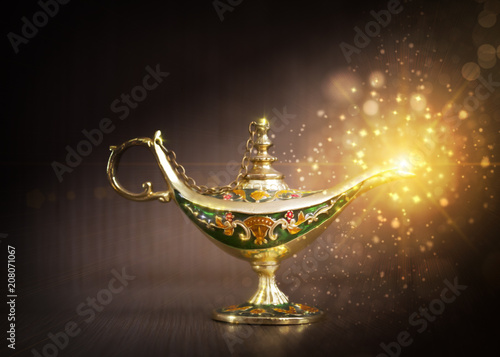 magical oriental lamp, the lamp of fulfillment of desires on a dark background