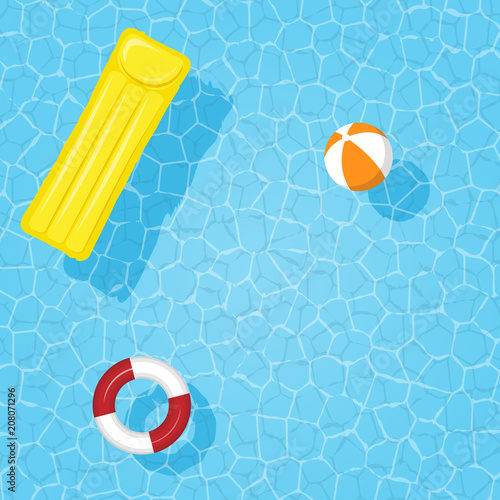 Water in the pool with an inflatable circle, mattress and ball. Place for text.