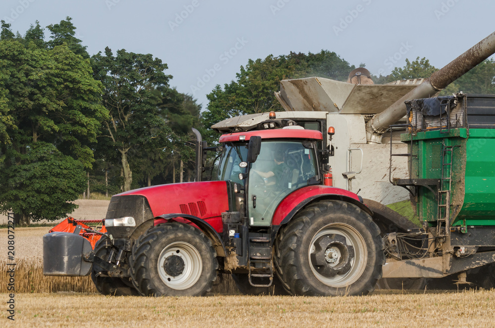 TRACTOR - Agricultural machinery on the field TRACTOR - Agricultural machinery on the field