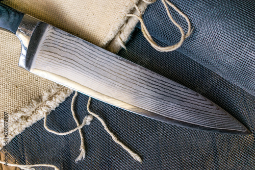 Table knife on the board.