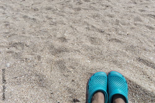 Blue sandals on the beach 