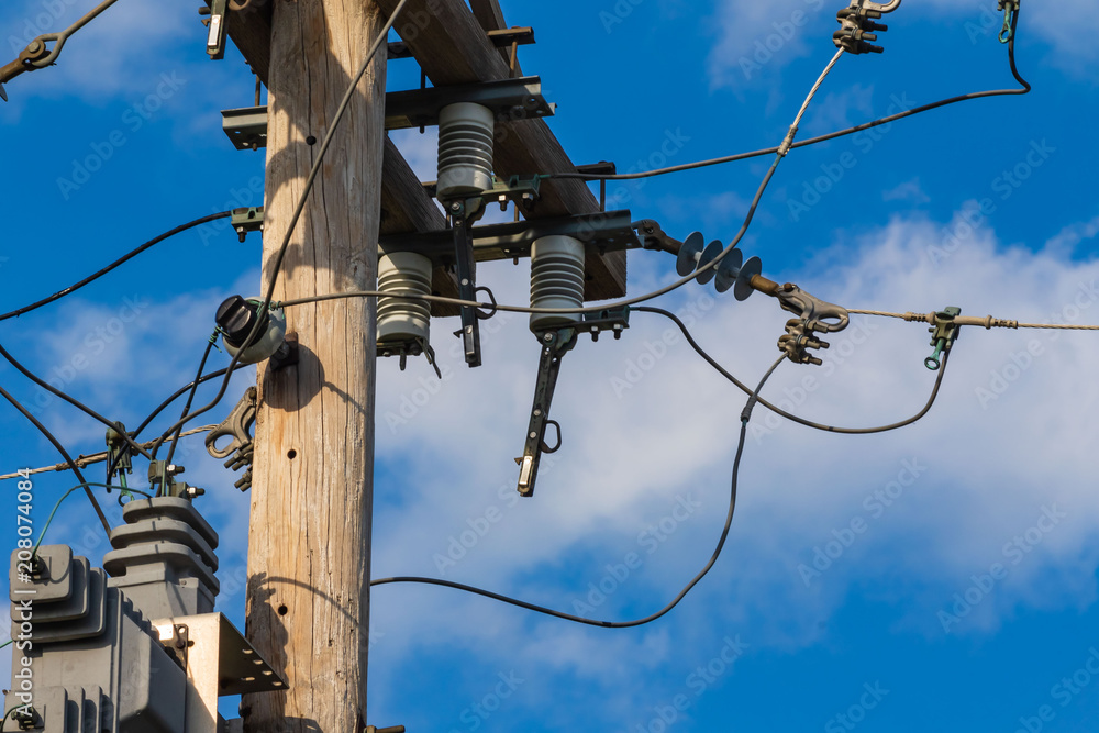 electrical equipment high up on a pole four electrical equipment high up on a pole four