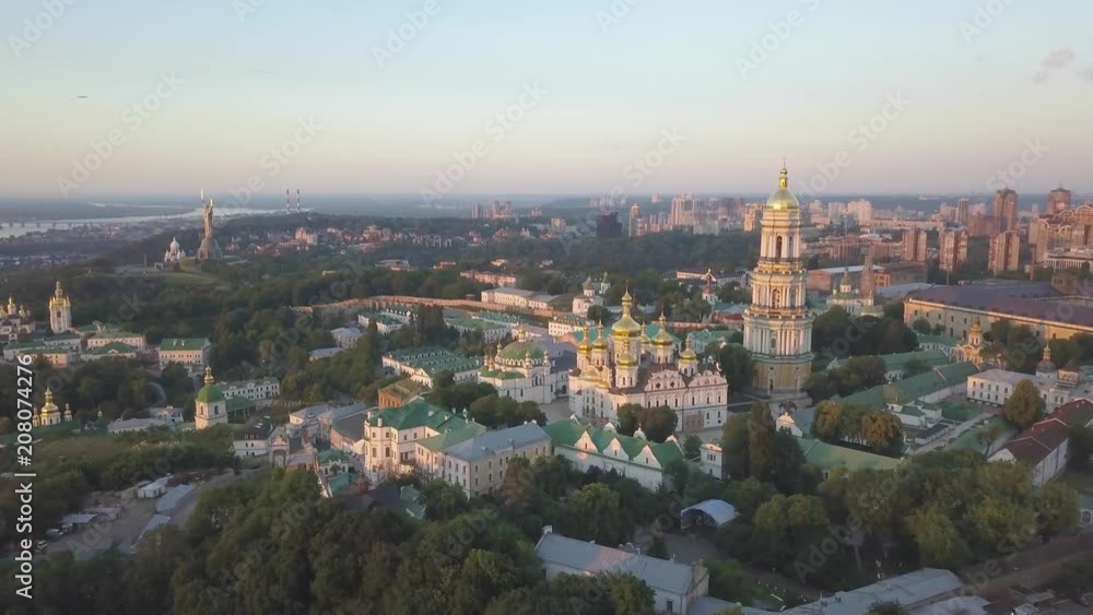 Aerial top panoramic view of Kiev Pechersk Lavra monastery and churches on hills from above at morning sunrise, Kyiv, Ukraine Aerial top panoramic view of Kiev Pechersk Lavra monastery and churches on hills from above at morning sunrise, Kyiv, Ukraine